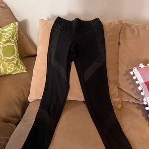 Express legging, XS . Black with leather trims running slant on legs.